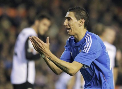 Real Madrid's Angel Di Maria celebrates after he scored against Valencia during their Spanish first division soccer match at the Mestalla st Real Madrid's Angel Di Maria celebrates after he scored against Valencia during their Spanish first division soccer match at the Mestalla st