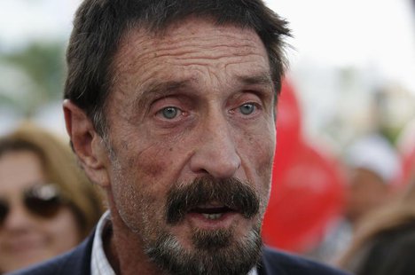 Computer software pioneer John McAfee speaks with reporters outside his hotel in Miami Beach, Florida December 13, 2012. REUTERS/Joe Skipper Computer software pioneer John McAfee speaks with reporters outside his hotel in Miami Beach, Florida December 13, 2012. REUTERS/Joe Skipper