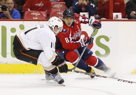Washington Capitals right wing Alex Ovechkin (8) skates with the puck in front of Anaheim Ducks center Saku Koivu (11) in the first period a Washington Capitals right wing Alex Ovechkin (8) skates with the puck in front of Anaheim Ducks center Saku Koivu (11) in the first period a