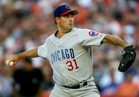 Chicago Cubs pitcher Greg Maddux delivers in the first inning against the New York Mets in their MLB game at Shea Stadium in New York July 2 Chicago Cubs pitcher Greg Maddux delivers in the first inning against the New York Mets in their MLB game at Shea Stadium in New York July 2