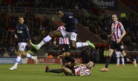 Manchester United's Danny Welbeck jumps over Sunderland's Phil Bardsley during their English League Cup semi-final first leg soccer match at Manchester United's Danny Welbeck jumps over Sunderland's Phil Bardsley during their English League Cup semi-final first leg soccer match at