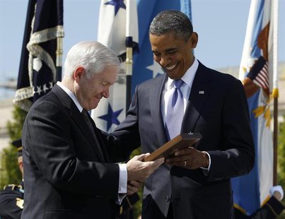 U.S. President Barack Obama presents retiring U.S. Defense Secretary Robert Gates with the Presidential Medal of Freedom during his farewell U.S. President Barack Obama presents retiring U.S. Defense Secretary Robert Gates with the Presidential Medal of Freedom during his farewell