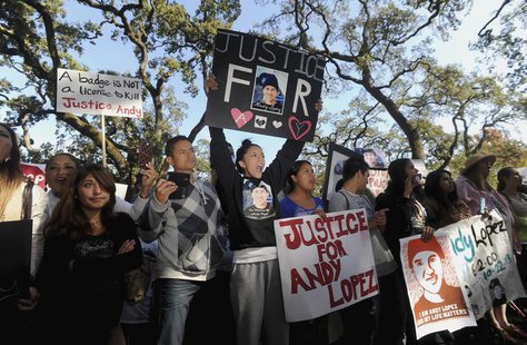 Vanessa Lopez, 15, holds a placard (in black) as she joins hundreds of protesters at Santa Rosa Junior College demanding justice for Andy Lo Vanessa Lopez, 15, holds a placard (in black) as she joins hundreds of protesters at Santa Rosa Junior College demanding justice for Andy Lo