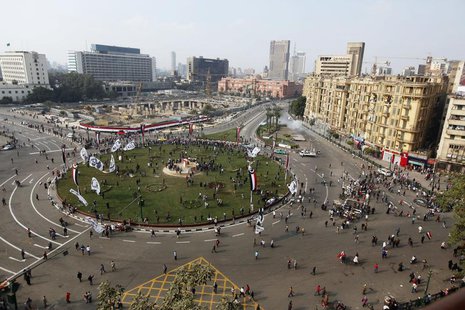 An aerial view shows security forces firing teargas to disperse a crowd in Cairo's Tahrir Square November 19, 2013. REUTERS/Mohamed Abd El G An aerial view shows security forces firing teargas to disperse a crowd in Cairo's Tahrir Square November 19, 2013. REUTERS/Mohamed Abd El G