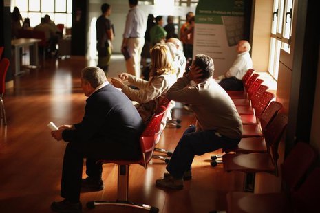 People wait inside a government-run employment office in Campillos, near Malaga, southern Spain May 6, 2013. REUTERS/Jon Nazca People wait inside a government-run employment office in Campillos, near Malaga, southern Spain May 6, 2013. REUTERS/Jon Nazca