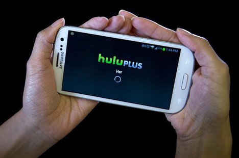 The HULU Plus app is played on a Samsung Galaxy phone in this photo-illustration in New York, December 23, 2013. REUTERS/Carlo Allegri The HULU Plus app is played on a Samsung Galaxy phone in this photo-illustration in New York, December 23, 2013. REUTERS/Carlo Allegri