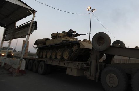 A tank is transported towards Anbar, to reinforce Iraqi troops in the province, west of Baghdad, January 6, 2014. REUTERS/Ahmed Saad A tank is transported towards Anbar, to reinforce Iraqi troops in the province, west of Baghdad, January 6, 2014. REUTERS/Ahmed Saad