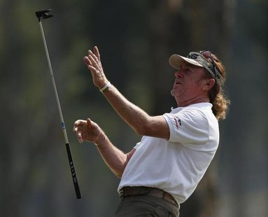 Defending champion Miguel Angel Jimenez from Spain throws his club after missing a putt on the ninth green during the second day of the Euro Defending champion Miguel Angel Jimenez from Spain throws his club after missing a putt on the ninth green during the second day of the Euro