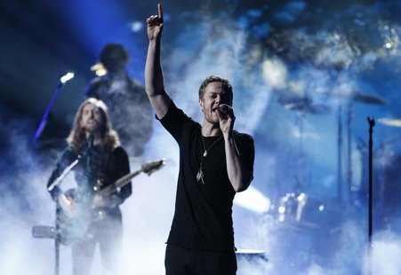 Dan Reynolds of Imagine Dragons performs a medley at the 41st American Music Awards in Los Angeles, California November 24, 2013. REUTERS/Lu Dan Reynolds of Imagine Dragons performs a medley at the 41st American Music Awards in Los Angeles, California November 24, 2013. REUTERS/Lu