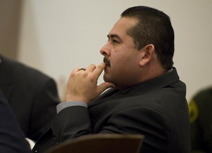 Former Fullerton police officer Manuel Ramos sits during his trial in Santa Ana, California January 7, 2014. REUTERS/Pool Former Fullerton police officer Manuel Ramos sits during his trial in Santa Ana, California January 7, 2014. REUTERS/Pool