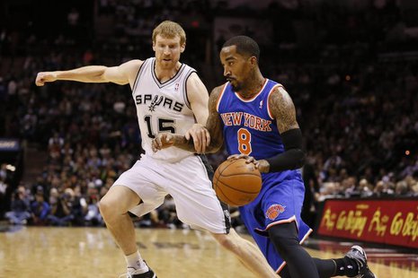 Jan 2, 2014; San Antonio, TX, USA; New York Knicks guard J.R. Smith (8) drives to the basket while guarded by San Antonio Spurs forward Matt Jan 2, 2014; San Antonio, TX, USA; New York Knicks guard J.R. Smith (8) drives to the basket while guarded by San Antonio Spurs forward Matt