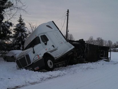 01-07-14 semi overturns on SR42 after slipping off road. photo provided by Vigo County Sheriff 01-07-14 semi overturns on SR42 after slipping off road. photo provided by Vigo County Sheriff