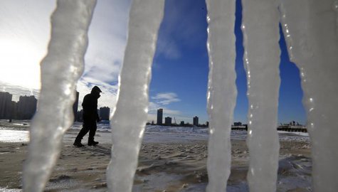 A man is framed by icicles as he walks along a beach in Chicago, Illinois, January 7, 2014.
CREDIT: REUTERS/JIM YOUNG (UNITED STATES - TAGS: ENVIRONMENT) A man is framed by icicles as he walks along a beach in Chicago, Illinois, January 7, 2014.
CREDIT: REUTERS/JIM YOUNG (UNITED STATES - TAGS: ENVIRONMENT)