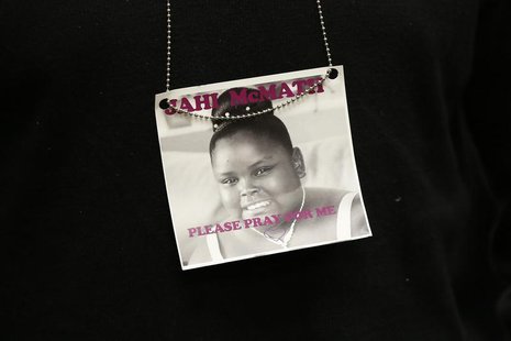 A photograph of 13-year-old Jahi McMath is seen on a necklace in Oakland, California December 24, 2013. REUTERS/Stephen Lam A photograph of 13-year-old Jahi McMath is seen on a necklace in Oakland, California December 24, 2013. REUTERS/Stephen Lam