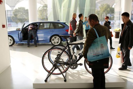 People are seen inside the BMW Experience Center in Shanghai November 19, 2013. REUTERS/Aly Song People are seen inside the BMW Experience Center in Shanghai November 19, 2013. REUTERS/Aly Song