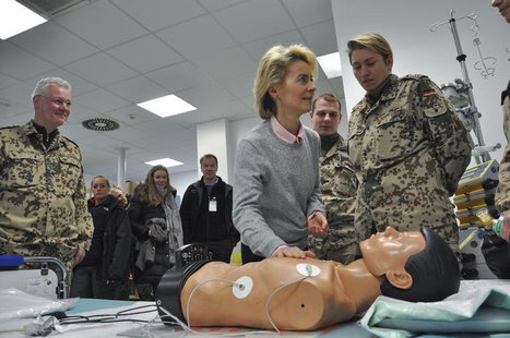 German Defence Minister Ursula von der Leyen (C) takes part in a medical training for CPR (cardiopulmonary resuscitation) on a dummy as she German Defence Minister Ursula von der Leyen (C) takes part in a medical training for CPR (cardiopulmonary resuscitation) on a dummy as she