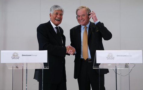 Maurice Levy (L) , French advertising group Publicis Chief executive, and John Wren, head of Omnicom Group react during a joint news confere Maurice Levy (L) , French advertising group Publicis Chief executive, and John Wren, head of Omnicom Group react during a joint news confere