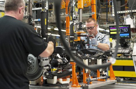 A production line worker installs a brake and rotor unit are on the rear axle assembly of a 2014 Jeep Cherokee at the upgraded North section A production line worker installs a brake and rotor unit are on the rear axle assembly of a 2014 Jeep Cherokee at the upgraded North section