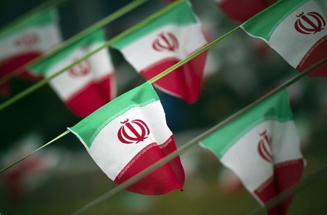 Iran's national flags are seen on a square in Tehran February 10, 2012. REUTERS/Morteza Nikoubazl Iran's national flags are seen on a square in Tehran February 10, 2012. REUTERS/Morteza Nikoubazl
