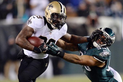 New Orleans Saints running back Khiry Robinson (29) stiff arms Philadelphia Eagles inside linebacker Mychal Kendricks (95) during the first New Orleans Saints running back Khiry Robinson (29) stiff arms Philadelphia Eagles inside linebacker Mychal Kendricks (95) during the first