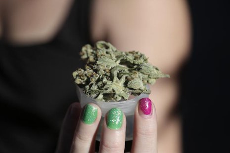 A grower holds out a product at the High Times U.S. Cannabis Cup in Seattle, Washington September 8, 2013. REUTERS/Jason Redmond A grower holds out a product at the High Times U.S. Cannabis Cup in Seattle, Washington September 8, 2013. REUTERS/Jason Redmond