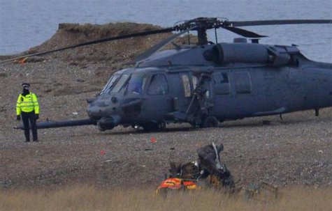 A police officer stands by a Pave Hawk helicopter, at the scene of a helicopter crash on the coast near the village of Cley next the Sea in Norfolk, eastern England January 8, 2014.
CREDIT: REUTERS/TOBY MELVILLE A police officer stands by a Pave Hawk helicopter, at the scene of a helicopter crash on the coast near the village of Cley next the Sea in Norfolk, eastern England January 8, 2014.
CREDIT: REUTERS/TOBY MELVILLE