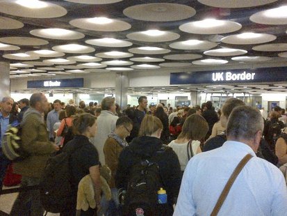 Travellers queue to be processed by UK Border Agency immigration control officers at Heathrow airport's Terminal 5 in London May 20, 2012. P Travellers queue to be processed by UK Border Agency immigration control officers at Heathrow airport's Terminal 5 in London May 20, 2012. P