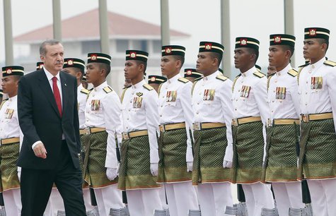 Turkey's Prime Minister Tayyip Erdogan inspects an honour guard during the state welcoming ceremony outside the office of Malaysia's Prime M Turkey's Prime Minister Tayyip Erdogan inspects an honour guard during the state welcoming ceremony outside the office of Malaysia's Prime M
