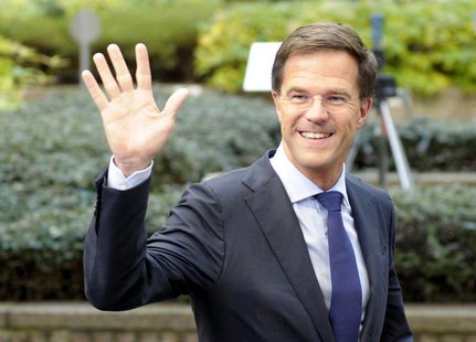 The Netherlands' Prime Minister Mark Rutte waves to the media upon arriving at a European Union leaders summit at the EU council headquarter The Netherlands' Prime Minister Mark Rutte waves to the media upon arriving at a European Union leaders summit at the EU council headquarter