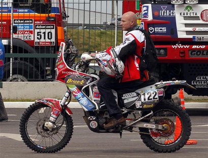 Belgium's Eric Palante rides his Honda for a technical verification exercise of the sixth South American edition of the Dakar Rally 2014, in Belgium's Eric Palante rides his Honda for a technical verification exercise of the sixth South American edition of the Dakar Rally 2014, in