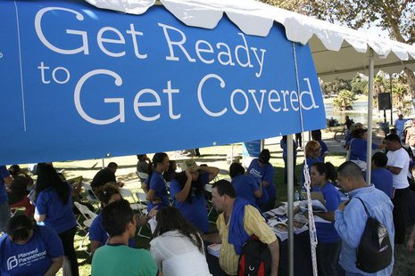 People gather for information during a Planned Parenthood Affordable Care Act outreach event for the Latino community in Los Angeles, Califo People gather for information during a Planned Parenthood Affordable Care Act outreach event for the Latino community in Los Angeles, Califo