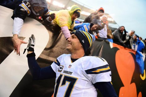 San Diego Chargers quarterback Philip Rivers (17) celebrates with fans after defeating the Cincinnati Bengals 27-10 to win AFC wild card pla San Diego Chargers quarterback Philip Rivers (17) celebrates with fans after defeating the Cincinnati Bengals 27-10 to win AFC wild card pla