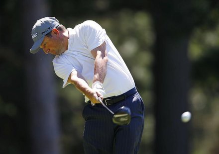 South Africa's Tim Clark hits from the 10th tee during the third round of the 2013 PGA Championship golf tournament at Oak Hill Country Club South Africa's Tim Clark hits from the 10th tee during the third round of the 2013 PGA Championship golf tournament at Oak Hill Country Club