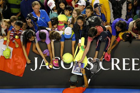 Rafael Nadal of Spain signs autographs for fans during the Kids Tennis Day before the Australian Open 2014 tennis tournament in Melbourne, J Rafael Nadal of Spain signs autographs for fans during the Kids Tennis Day before the Australian Open 2014 tennis tournament in Melbourne, J