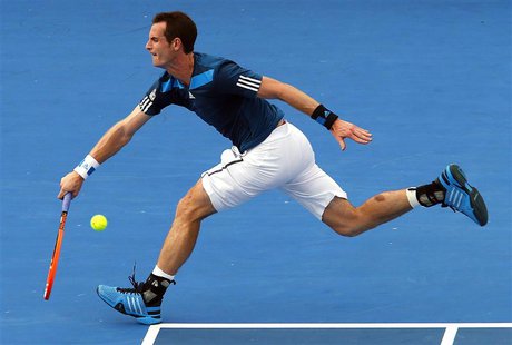 Britain's Andy Murray stretches to hit a shot during an exhibition match against Australia's Lleyton Hewitt at the Kooyong Classic tennis to Britain's Andy Murray stretches to hit a shot during an exhibition match against Australia's Lleyton Hewitt at the Kooyong Classic tennis to