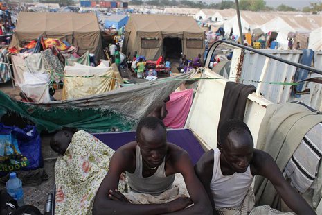 Displaced men rest in an improvised shelter at Tomping camp, where some 17,000 displaced people who fled their homes are being sheltered by Displaced men rest in an improvised shelter at Tomping camp, where some 17,000 displaced people who fled their homes are being sheltered by