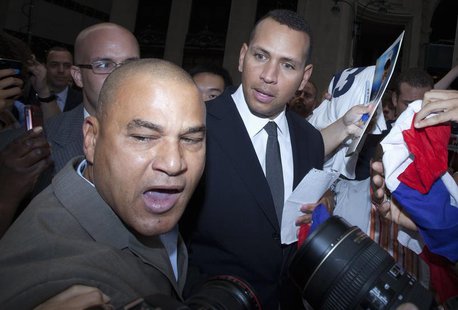 New York Yankees baseball player Alex Rodriguez looks at Fernando Mateo, the president of Hispanics Across America outside Major League Base New York Yankees baseball player Alex Rodriguez looks at Fernando Mateo, the president of Hispanics Across America outside Major League Base