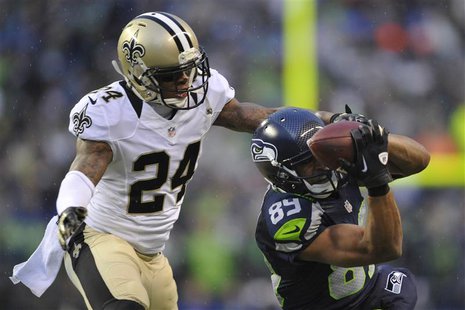 Jan 11, 2014; Seattle, WA, USA; Seattle Seahawks wide receiver Doug Baldwin (89) catches a pass against New Orleans Saints cornerback Corey Jan 11, 2014; Seattle, WA, USA; Seattle Seahawks wide receiver Doug Baldwin (89) catches a pass against New Orleans Saints cornerback Corey