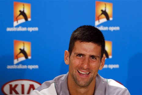Current Australian Open champion Novak Djokovic of Serbia smiles during a news conference at the Australian Open 2014 tennis tournament in M Current Australian Open champion Novak Djokovic of Serbia smiles during a news conference at the Australian Open 2014 tennis tournament in M