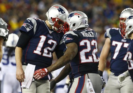 Jan 11, 2014; Foxborough, MA, USA; New England Patriots running back Stevan Ridley (22) celebrates with quarterback Tom Brady (12) after a t Jan 11, 2014; Foxborough, MA, USA; New England Patriots running back Stevan Ridley (22) celebrates with quarterback Tom Brady (12) after a t