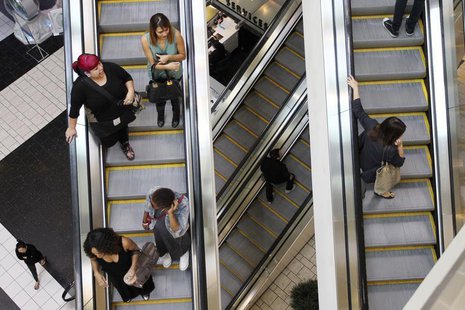 Shoppers ride escalators at the Beverly Center mall in Los Angeles, California November 8, 2013. REUTERS/David McNew Shoppers ride escalators at the Beverly Center mall in Los Angeles, California November 8, 2013. REUTERS/David McNew