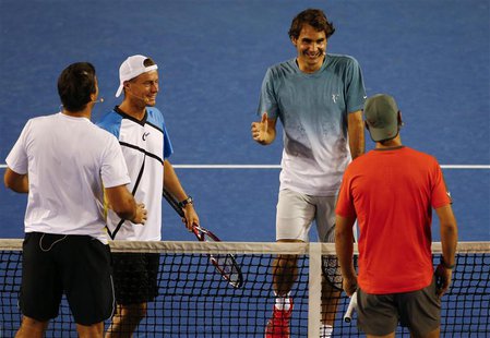 Roger Federer of Switzerland (2nd R) smiles as he goes to shake hands with Rafael Nadal of Spain (R) as Lleyton Hewitt of Australia (2nd L) Roger Federer of Switzerland (2nd R) smiles as he goes to shake hands with Rafael Nadal of Spain (R) as Lleyton Hewitt of Australia (2nd L)