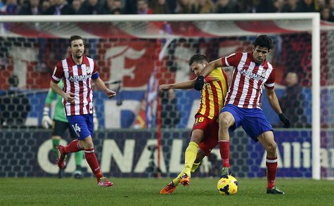 Barcelona's Jordi Alba (C) fights for the ball with Atletico Madrid's Diego Costa (R) during their Spanish first division soccer match at th Barcelona's Jordi Alba (C) fights for the ball with Atletico Madrid's Diego Costa (R) during their Spanish first division soccer match at th