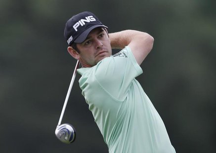 South Africa's Louis Oosthuizen tees off on the 14th hole during the first round of the 2013 U.S. Open golf championship at the Merion Golf South Africa's Louis Oosthuizen tees off on the 14th hole during the first round of the 2013 U.S. Open golf championship at the Merion Golf