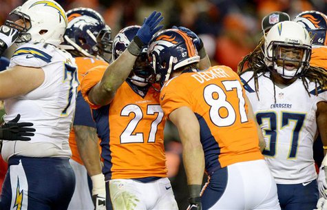 Jan 12, 2014; Denver, CO, USA; Denver Broncos running back Knowshon Moreno (27) celebrates with receiver Eric Decker (87) after scoring a to Jan 12, 2014; Denver, CO, USA; Denver Broncos running back Knowshon Moreno (27) celebrates with receiver Eric Decker (87) after scoring a to