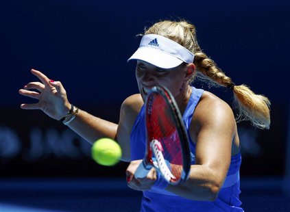 Angelique Kerber of Germany hits a return to Jarmila Gajdosova of Australia during their women's singles match at the Australian Open 2014 t Angelique Kerber of Germany hits a return to Jarmila Gajdosova of Australia during their women's singles match at the Australian Open 2014 t