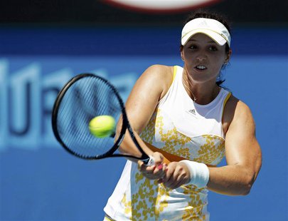 Laura Robson of Britain hits a return to Kirsten Flipkens of Belgium during their women's singles match at the Australian Open 2014 tennis t Laura Robson of Britain hits a return to Kirsten Flipkens of Belgium during their women's singles match at the Australian Open 2014 tennis t
