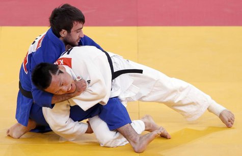 South Korea's Wang Ki-Chun fights with Russia's Mansur Isaev (blue) during their men's -73kg semi-final A judo match at the London 2012 Olym South Korea's Wang Ki-Chun fights with Russia's Mansur Isaev (blue) during their men's -73kg semi-final A judo match at the London 2012 Olym
