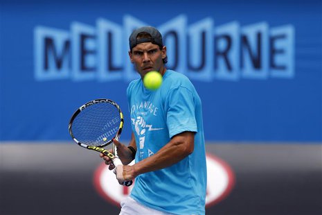Rafael Nadal of Spain hits a return during a practice session at the Australian Open 2014 tennis tournament in Melbourne January 12, 2014. R Rafael Nadal of Spain hits a return during a practice session at the Australian Open 2014 tennis tournament in Melbourne January 12, 2014. R