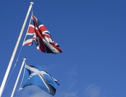 The Saltire (R) and Union Flag fly together in a street before a debate in the Scottish Parliament on ‘Scotland’s future,’ in Edinburgh, Sco The Saltire (R) and Union Flag fly together in a street before a debate in the Scottish Parliament on ‘Scotland’s future,’ in Edinburgh, Sco